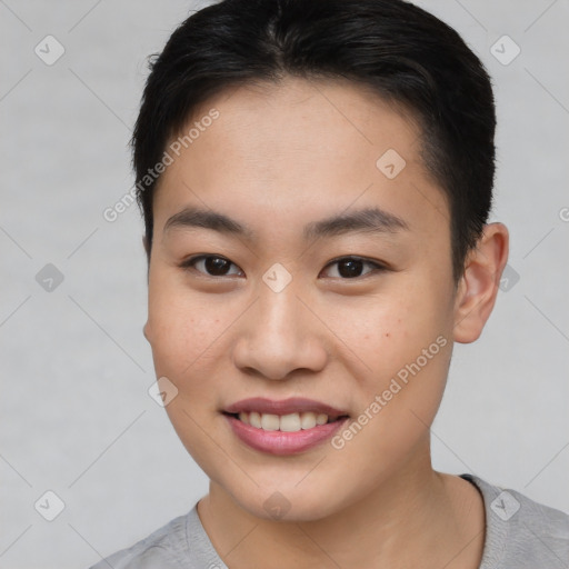 Joyful asian young-adult female with short  brown hair and brown eyes