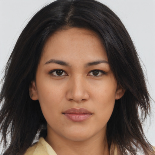 Joyful asian young-adult female with long  brown hair and brown eyes