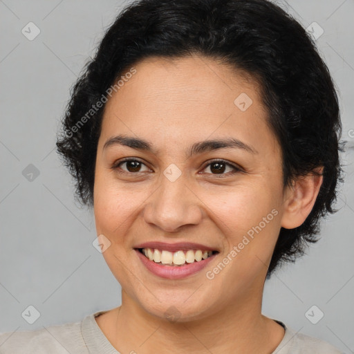 Joyful latino young-adult female with short  brown hair and brown eyes