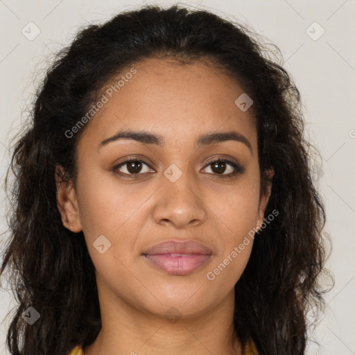 Joyful black young-adult female with long  brown hair and brown eyes