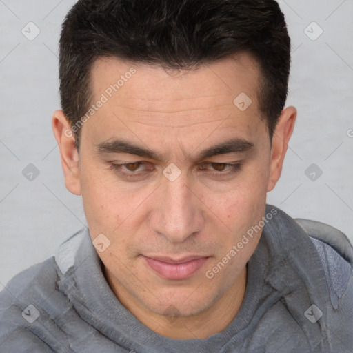 Joyful white adult male with short  brown hair and brown eyes