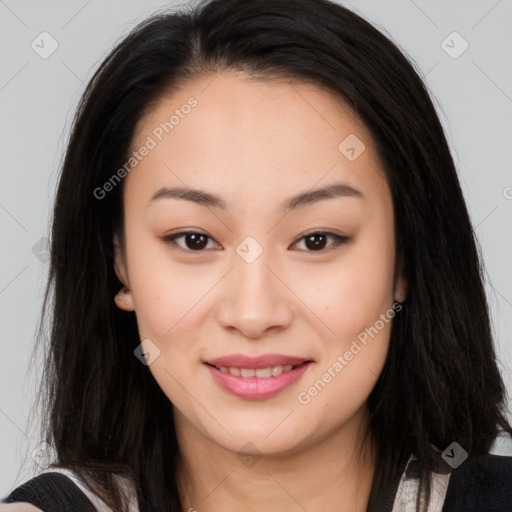 Joyful asian young-adult female with long  brown hair and brown eyes