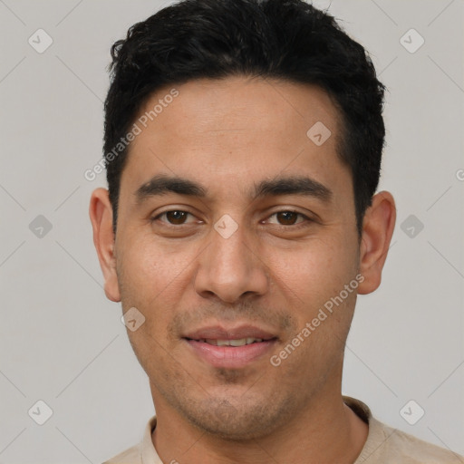 Joyful white young-adult male with short  black hair and brown eyes