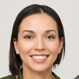 Joyful white young-adult female with medium  brown hair and brown eyes