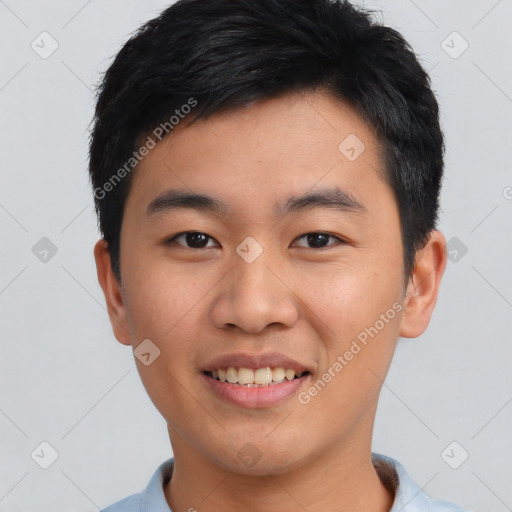 Joyful asian young-adult male with short  black hair and brown eyes