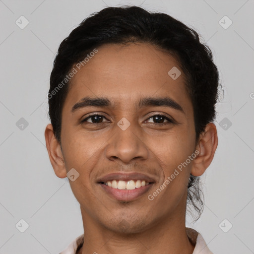 Joyful latino young-adult male with short  brown hair and brown eyes