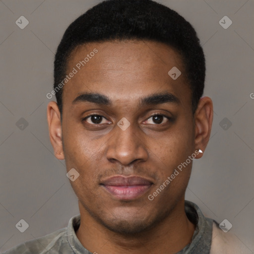 Joyful black young-adult male with short  brown hair and brown eyes