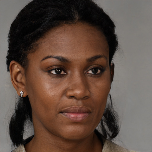 Neutral black young-adult female with medium  brown hair and brown eyes