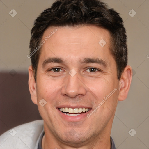 Joyful white adult male with short  brown hair and brown eyes