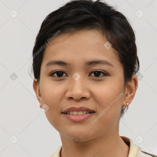 Joyful asian young-adult female with short  brown hair and brown eyes