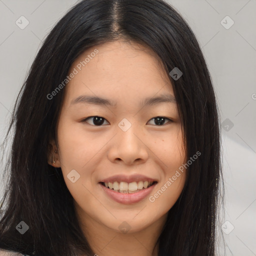 Joyful asian young-adult female with long  brown hair and brown eyes