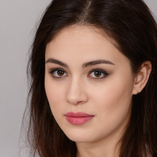 Neutral white young-adult female with long  brown hair and brown eyes