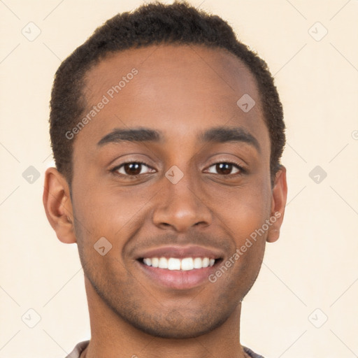 Joyful black young-adult male with short  brown hair and brown eyes