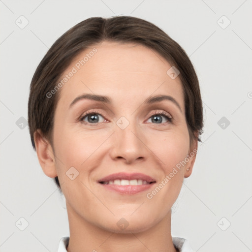 Joyful white young-adult female with short  brown hair and grey eyes