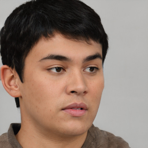 Neutral asian young-adult male with short  brown hair and brown eyes