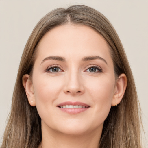 Joyful white young-adult female with long  brown hair and grey eyes