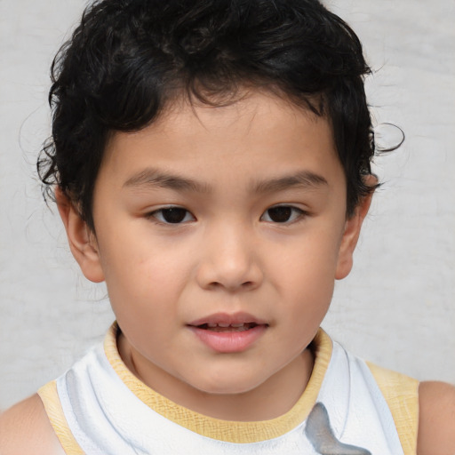 Joyful white child male with short  brown hair and brown eyes