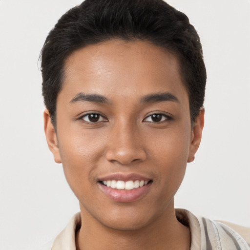 Joyful latino young-adult female with short  brown hair and brown eyes