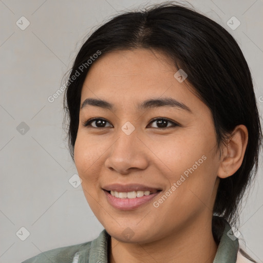 Joyful asian young-adult female with medium  black hair and brown eyes