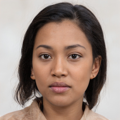 Neutral latino young-adult female with medium  brown hair and brown eyes