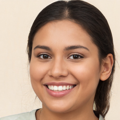 Joyful white young-adult female with medium  brown hair and brown eyes