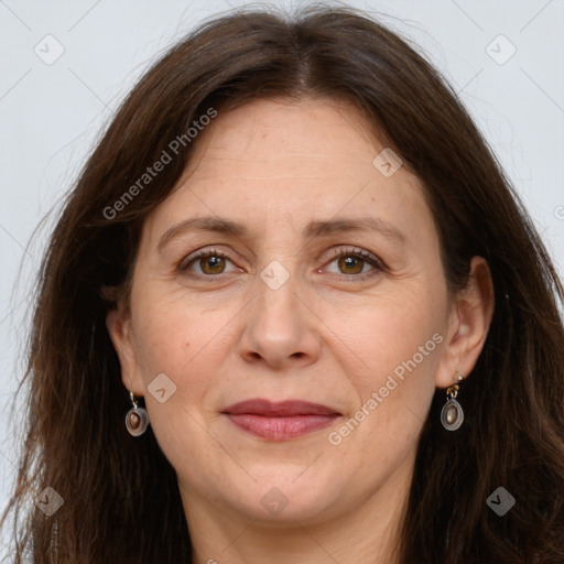 Joyful white adult female with long  brown hair and grey eyes