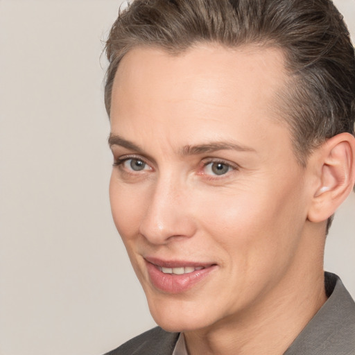 Joyful white adult female with short  brown hair and brown eyes