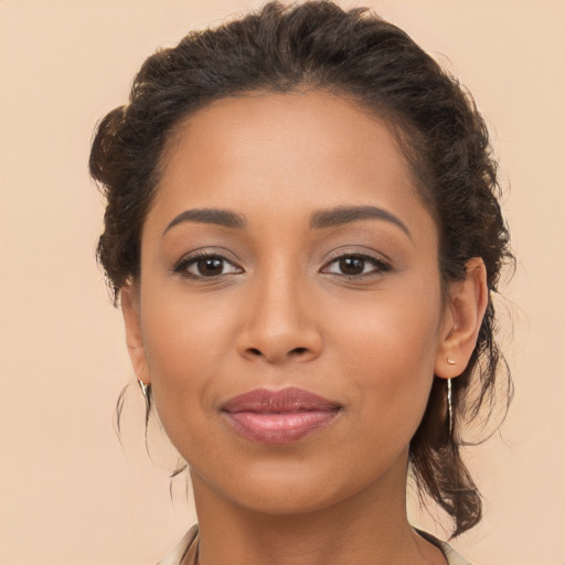 Joyful latino young-adult female with long  brown hair and brown eyes