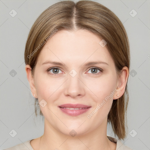 Joyful white young-adult female with medium  brown hair and grey eyes