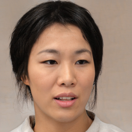 Neutral asian young-adult female with medium  black hair and brown eyes