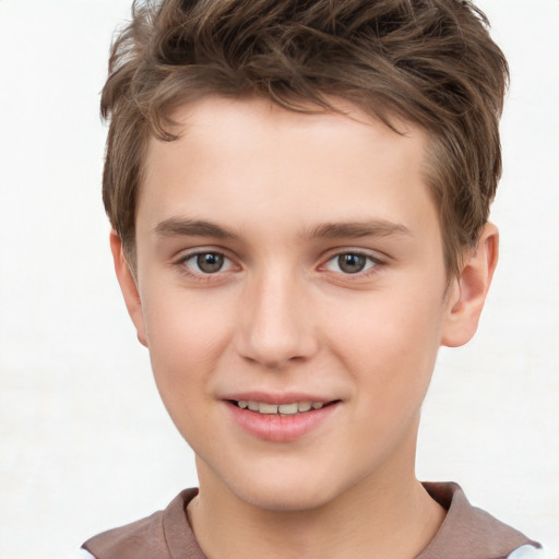 Joyful white child male with short  brown hair and brown eyes