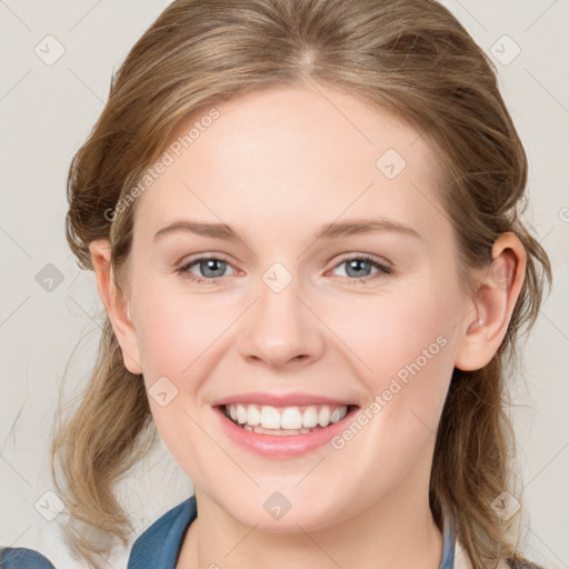 Joyful white young-adult female with medium  brown hair and blue eyes