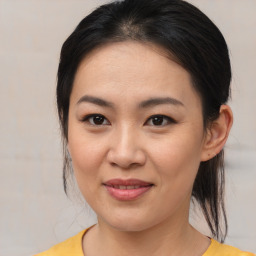 Joyful asian young-adult female with medium  brown hair and brown eyes