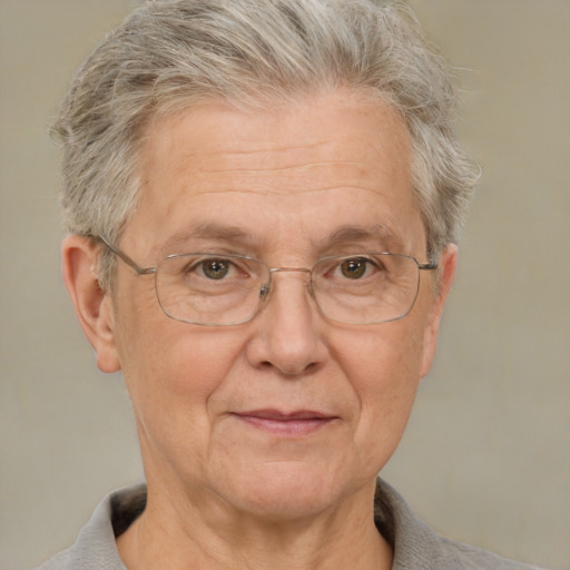 Joyful white middle-aged female with short  gray hair and brown eyes