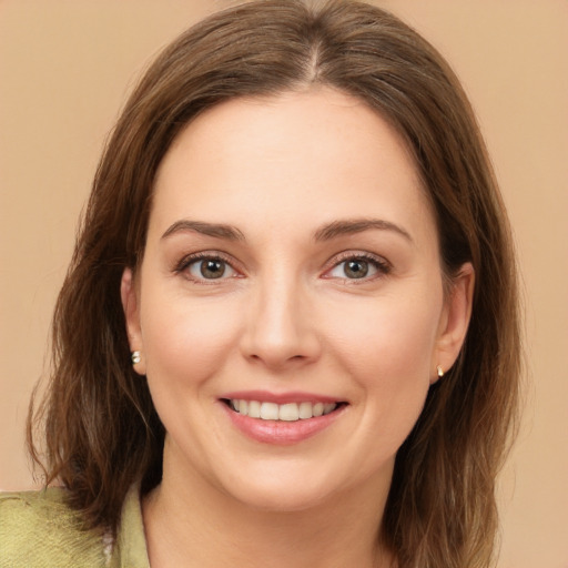 Joyful white young-adult female with medium  brown hair and brown eyes