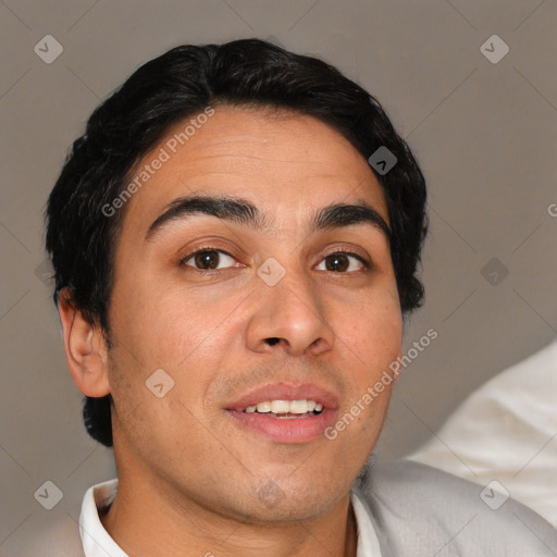 Joyful white young-adult male with short  black hair and brown eyes