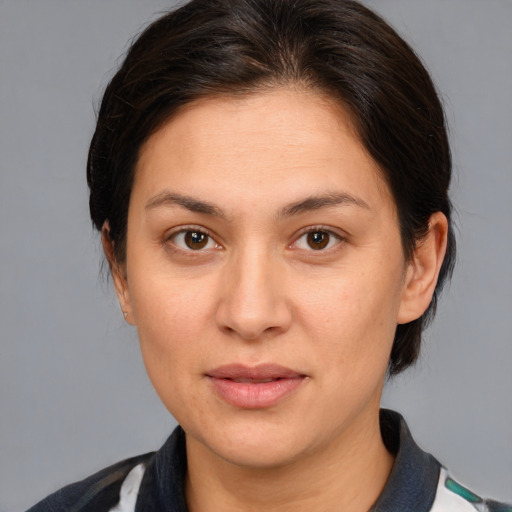 Joyful white adult female with medium  brown hair and brown eyes