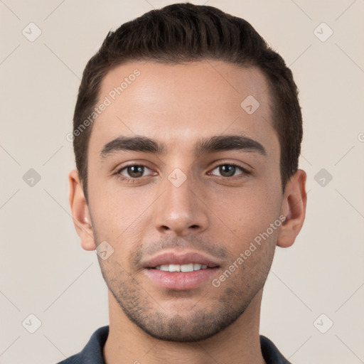 Joyful white young-adult male with short  brown hair and brown eyes