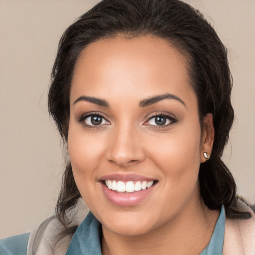 Joyful white young-adult female with medium  brown hair and brown eyes