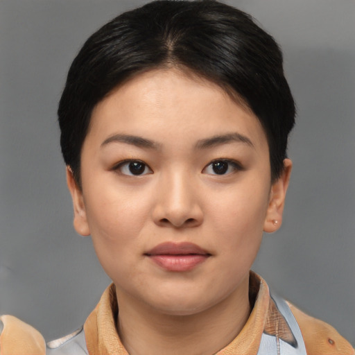 Joyful asian young-adult female with short  brown hair and brown eyes