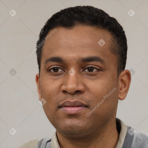 Neutral latino young-adult male with short  black hair and brown eyes
