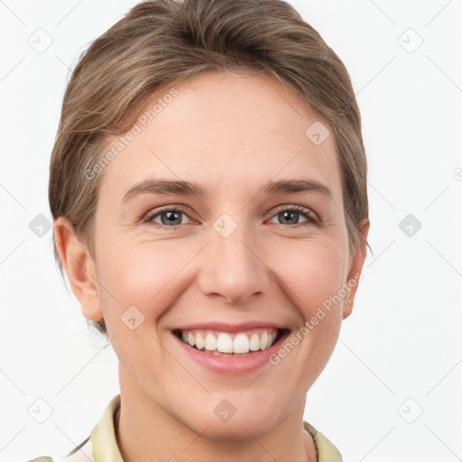 Joyful white young-adult female with short  brown hair and grey eyes