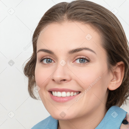 Joyful white young-adult female with medium  brown hair and blue eyes