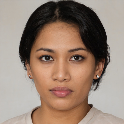 Neutral latino young-adult female with medium  black hair and brown eyes