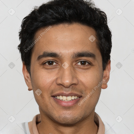 Joyful latino young-adult male with short  black hair and brown eyes