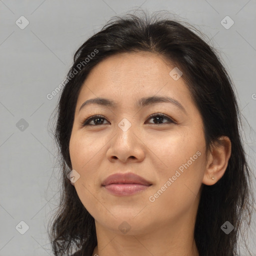 Joyful asian young-adult female with long  brown hair and brown eyes