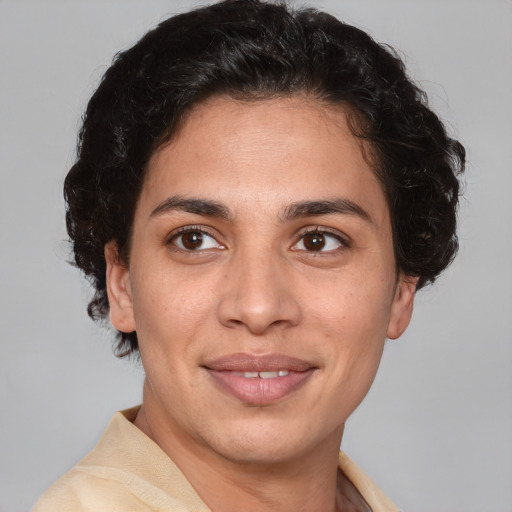 Joyful white adult female with short  brown hair and brown eyes