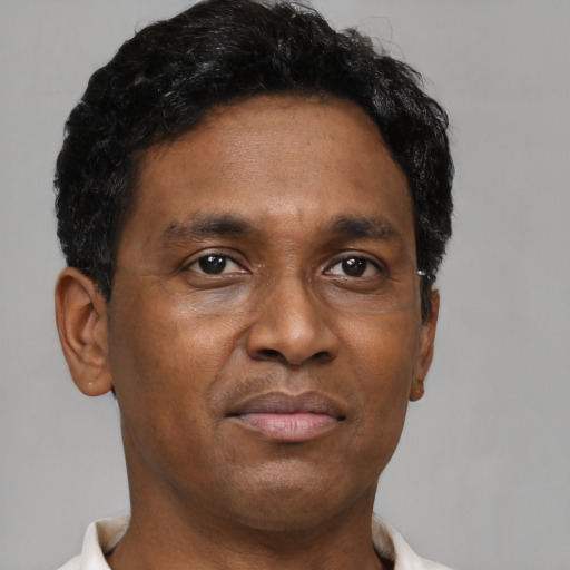 Neutral black adult male with short  brown hair and brown eyes