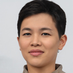 Joyful asian young-adult female with short  brown hair and brown eyes