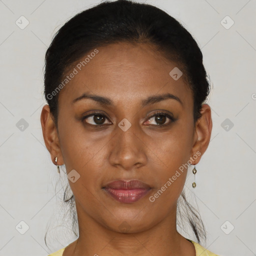 Joyful black young-adult female with short  brown hair and brown eyes